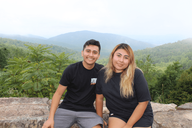 Sitting down together with the mountains behind us