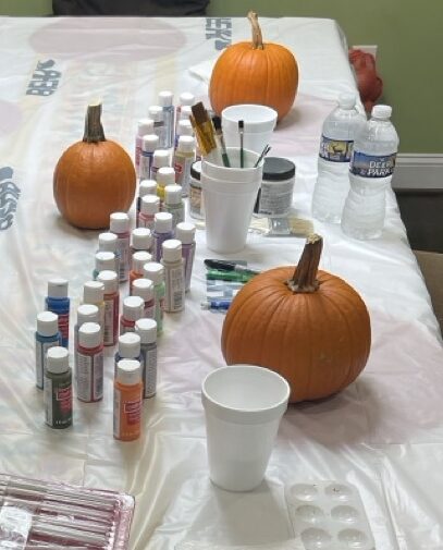 Pumpkins and Paint Supplies with a Table cloth